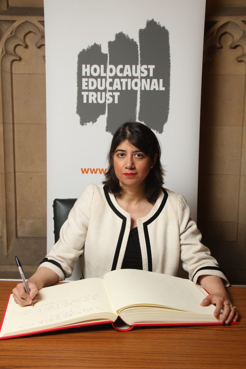 Seema Malhotra signing the Book of Remembrance