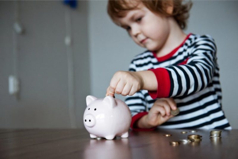 A child with a piggy bank