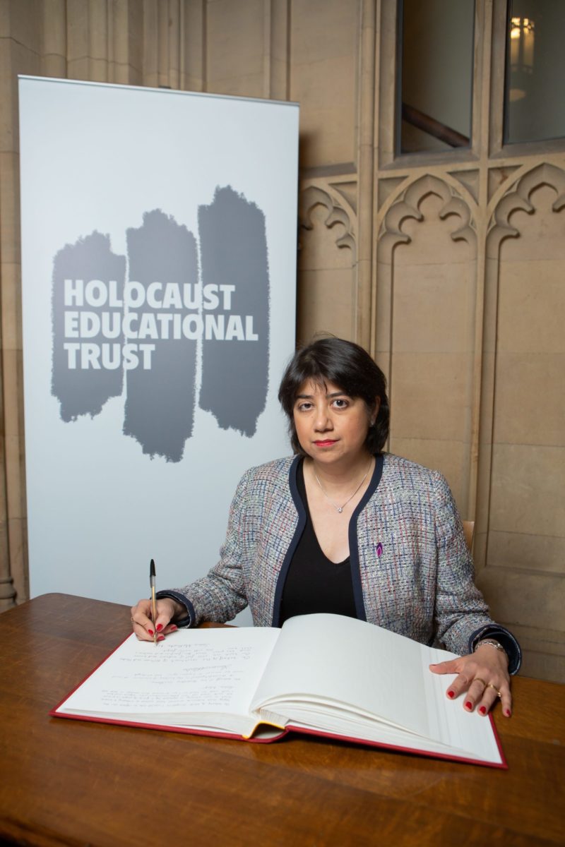 Seema Malhotra signing the Holocaust Educational Trust