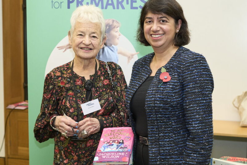 Seema Malhotra MP and Jacqueline Wilson holding a copy of a Jacqueline Wilson book